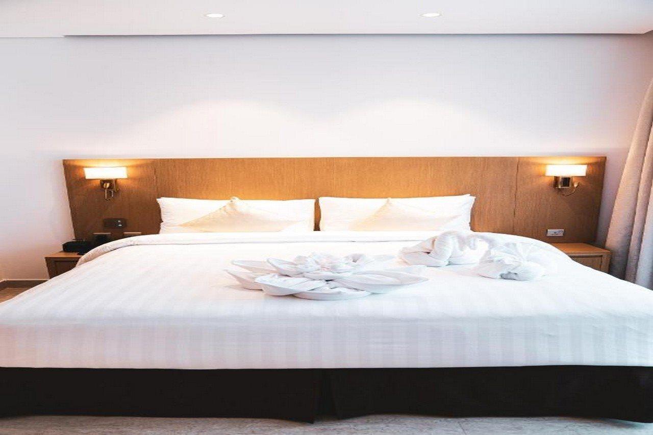 He Hotel Apartments Dubaj Kültér fotó A bed